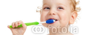 Smiling_kid_brushing_teeth.jpg