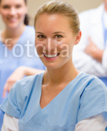 Smiling_medical_professional_team_at_the_surgery.jpg