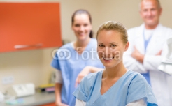 Smiling_medical_professional_team_at_the_surgery.jpg